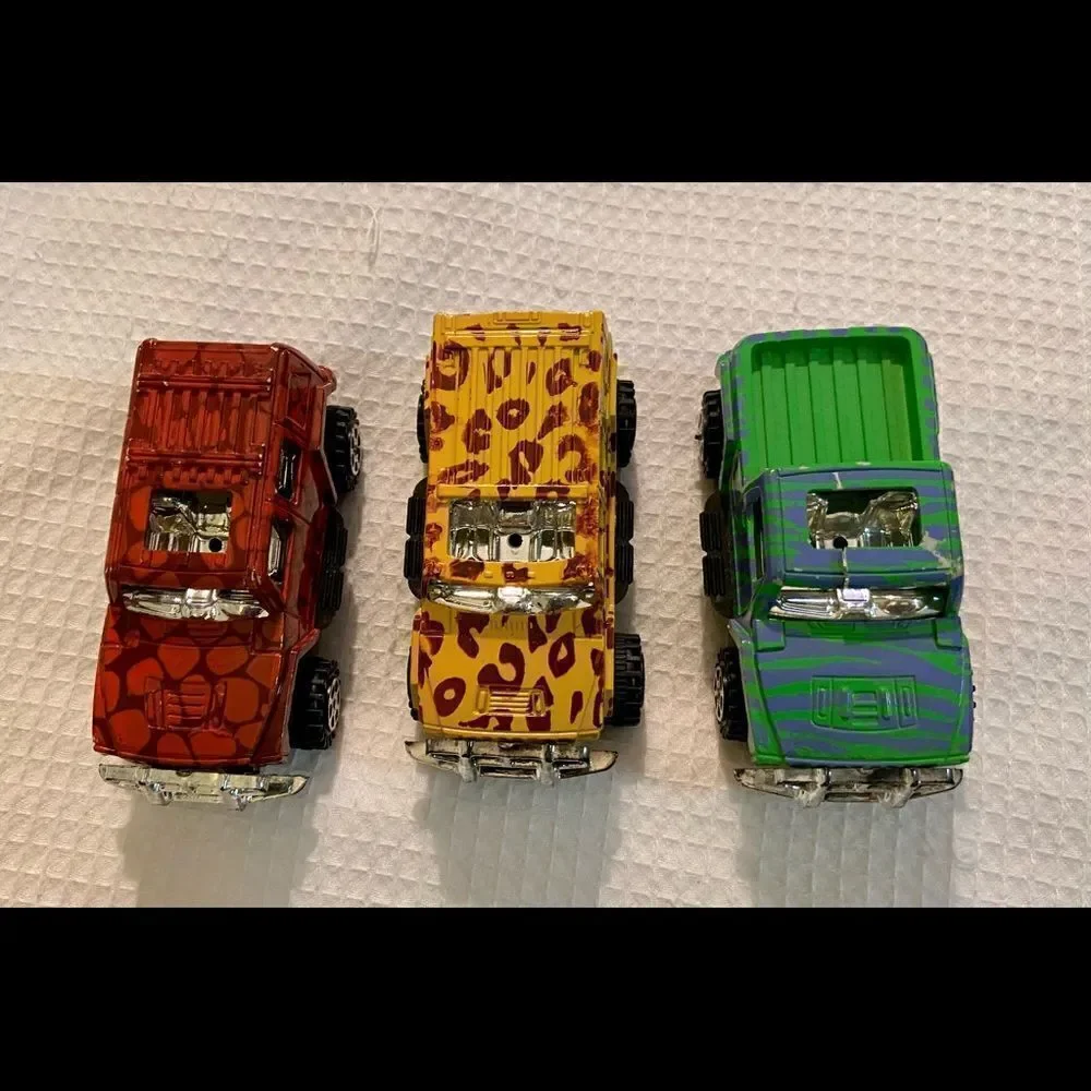 Vintage Lot Of 3 Toy 4 X 4 Trucks W Animal Prints Good Condition Unbranded.